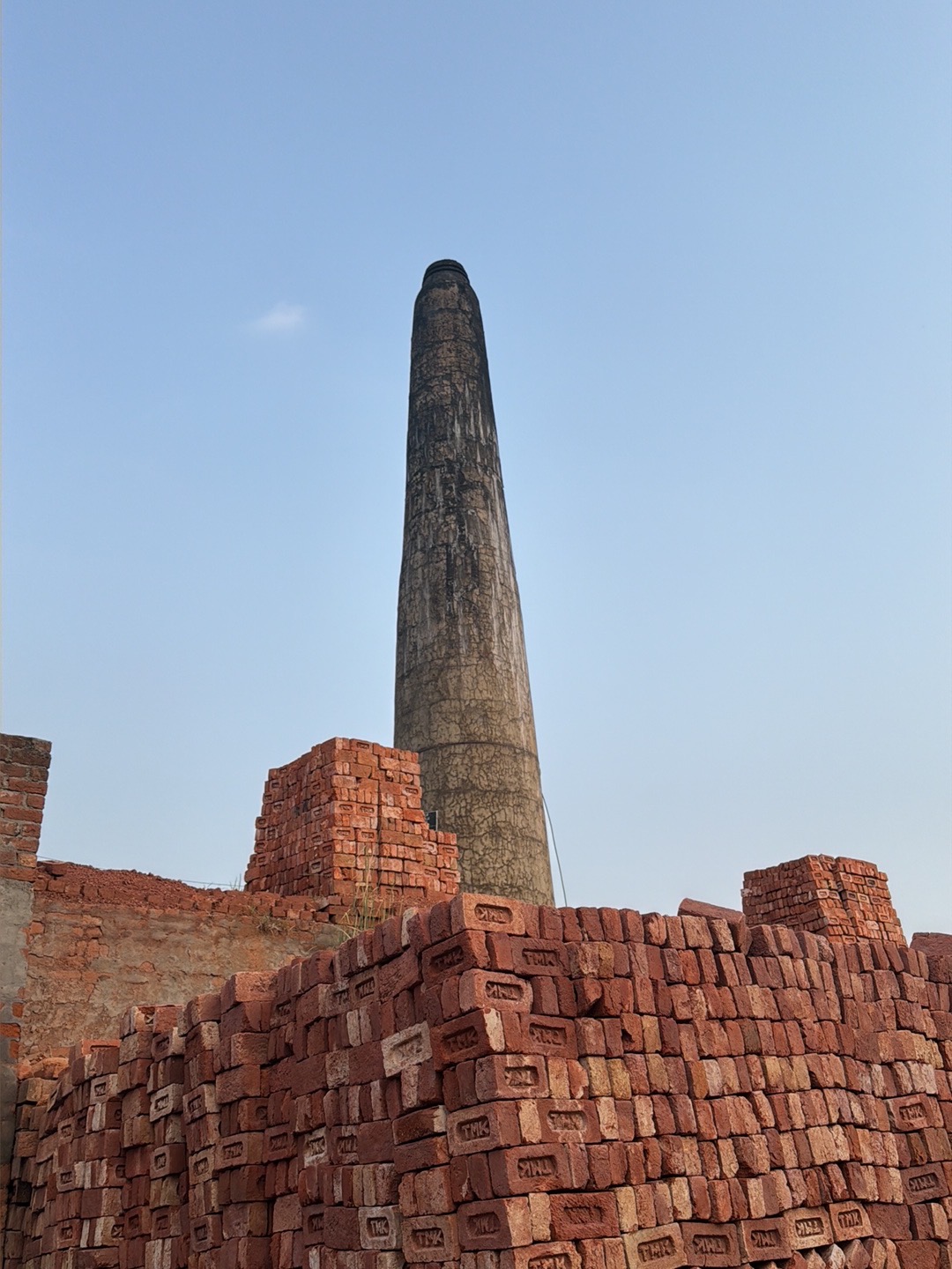 Nand Brick Kiln Chimney and Stacked Bricks